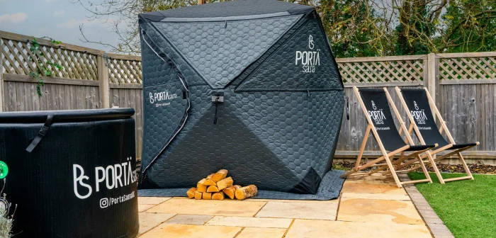 The wood-fired sauna and cold plunge tub set up with deck chairs