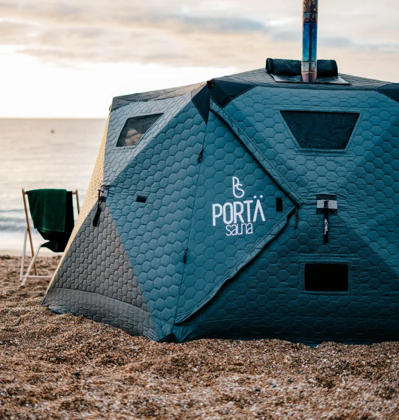 The wood-fired sauna pitched at the water's edge